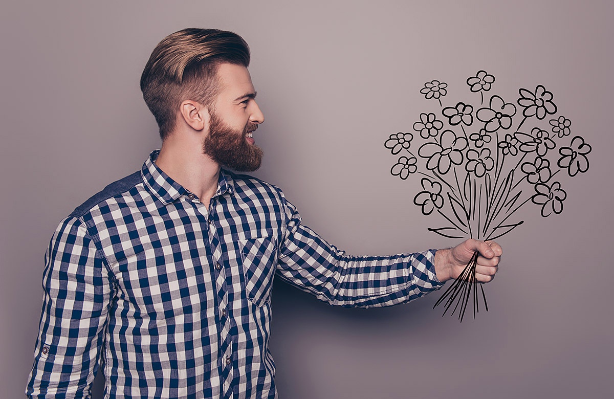 Man with a painted bouquet of flowers in his hands