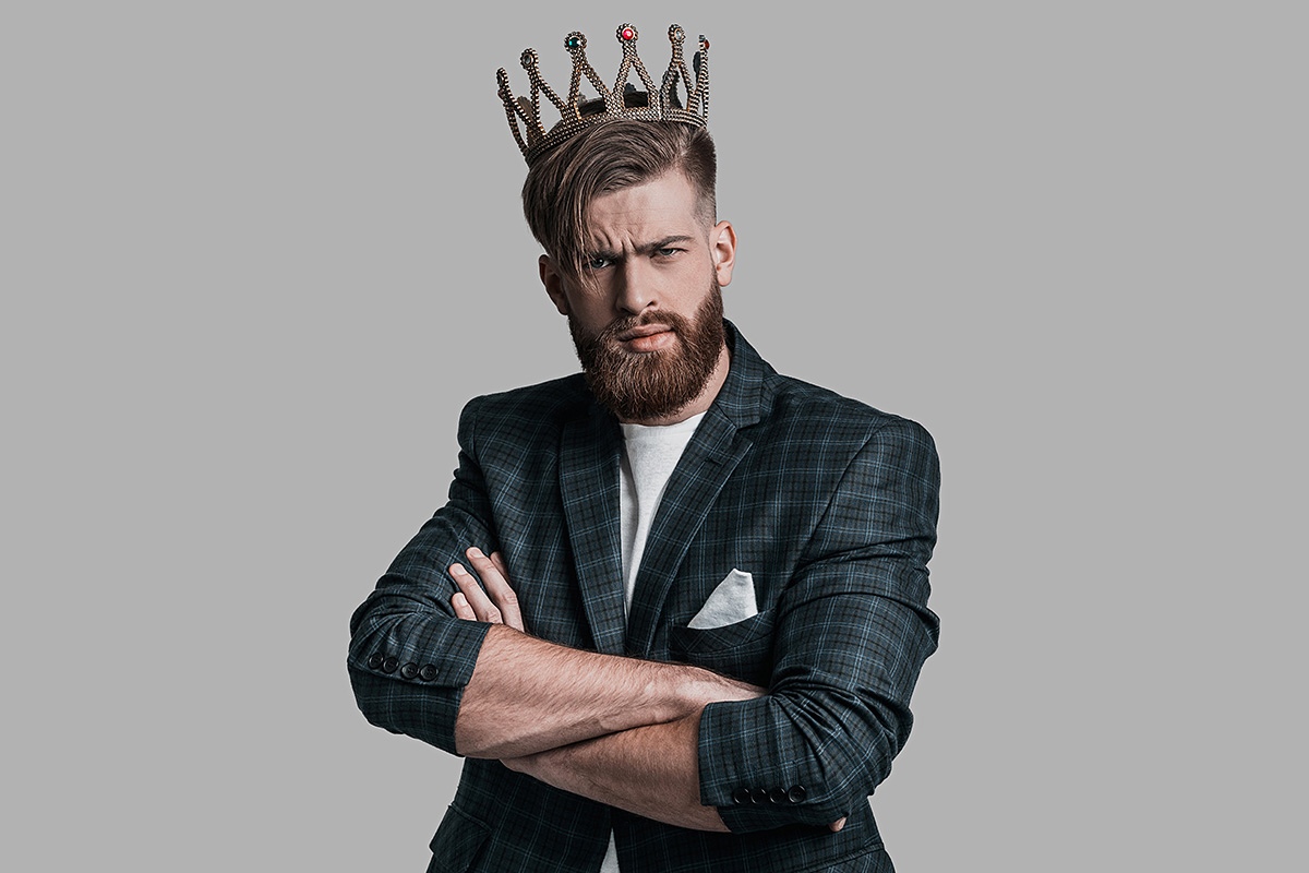 Selfish man with a crown on his head