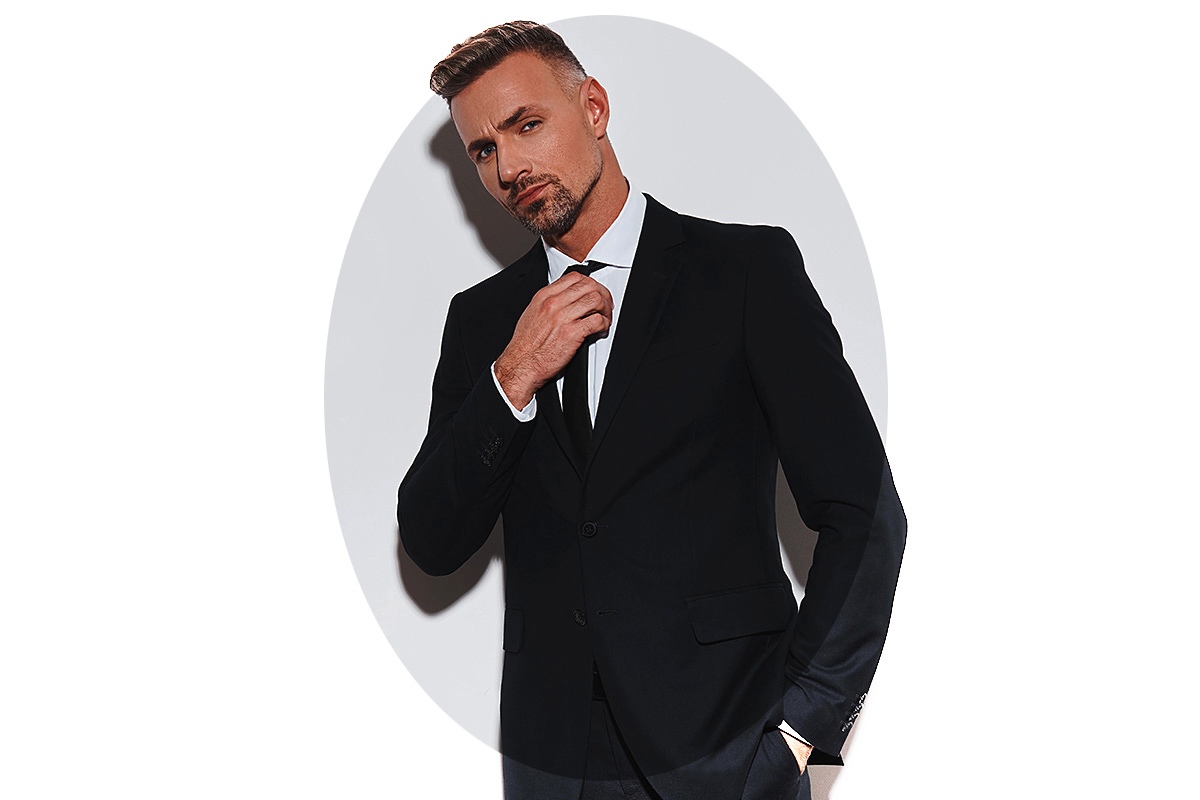 Image of an energetic man in a business suit