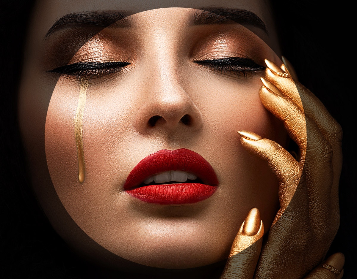 Image of an attractive woman with a tear flowing from one eye