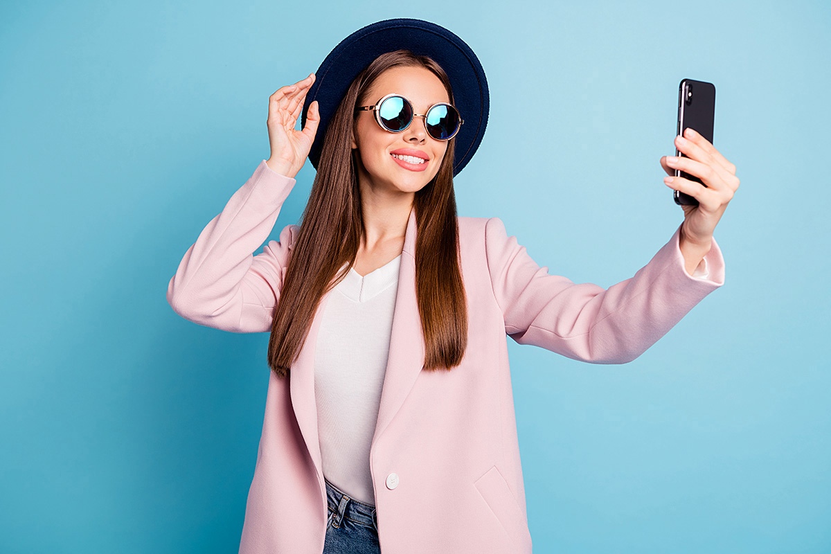 Image of modern woman with mobile phone in her hands