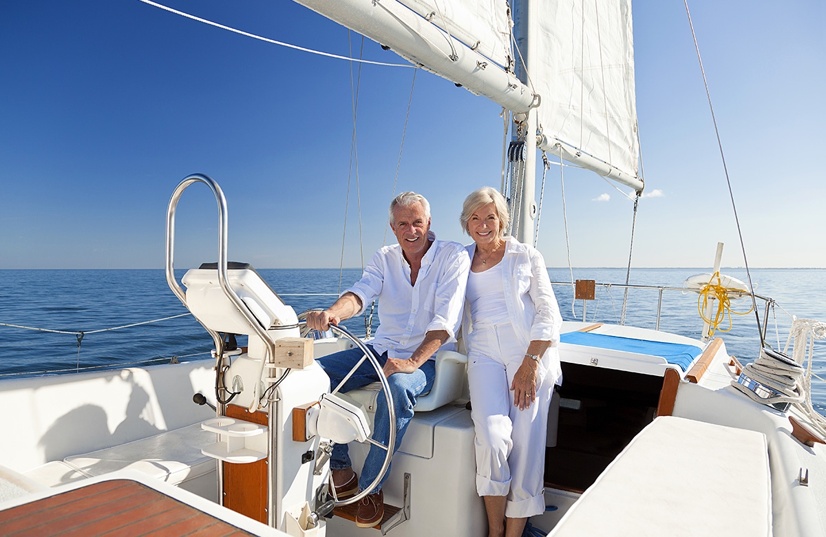 Wealthy man and woman sail on a yacht