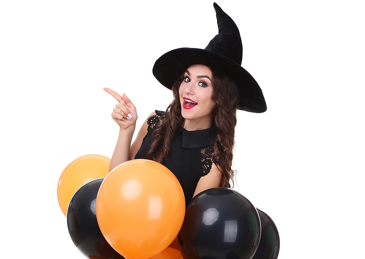 Girl in a big hat and with balloons