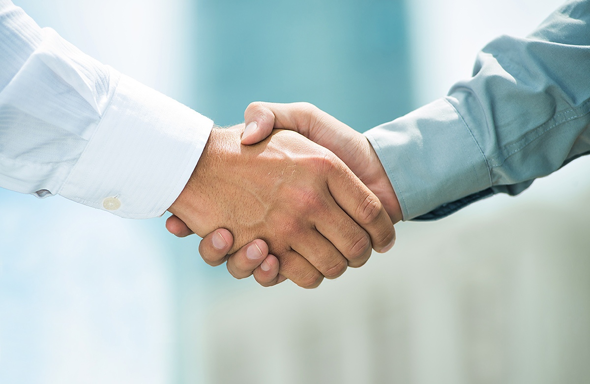 Image of a male handshake Image of a male handshake