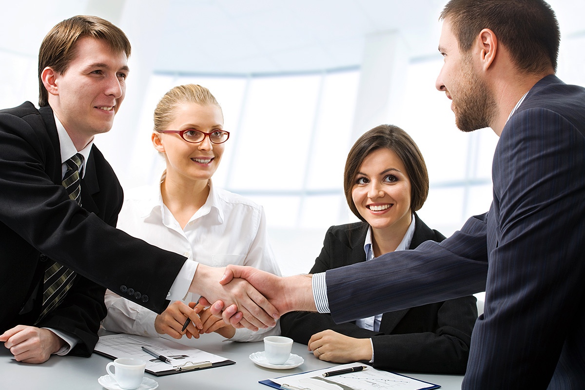 Image of a company of business people at a meeting
