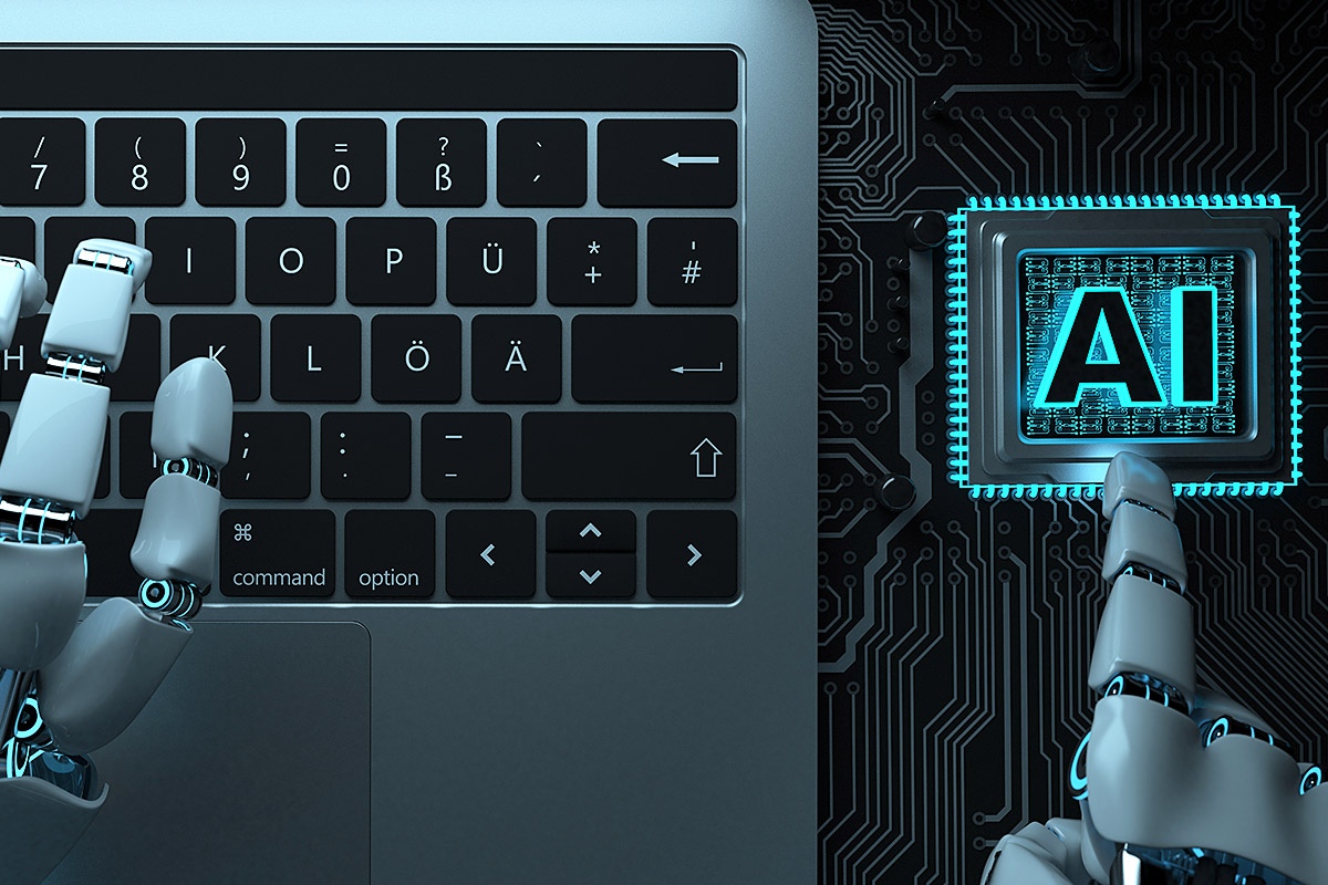 Image of robot hands and laptop