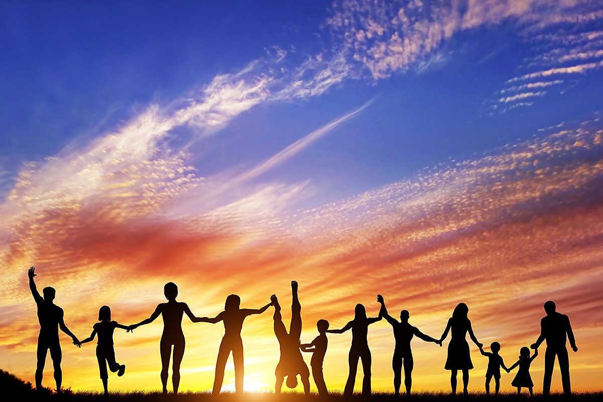 Image of children with parents at sunset