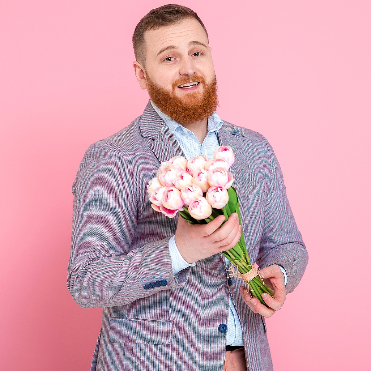 Image of a handsome man with a bouquet of flowers