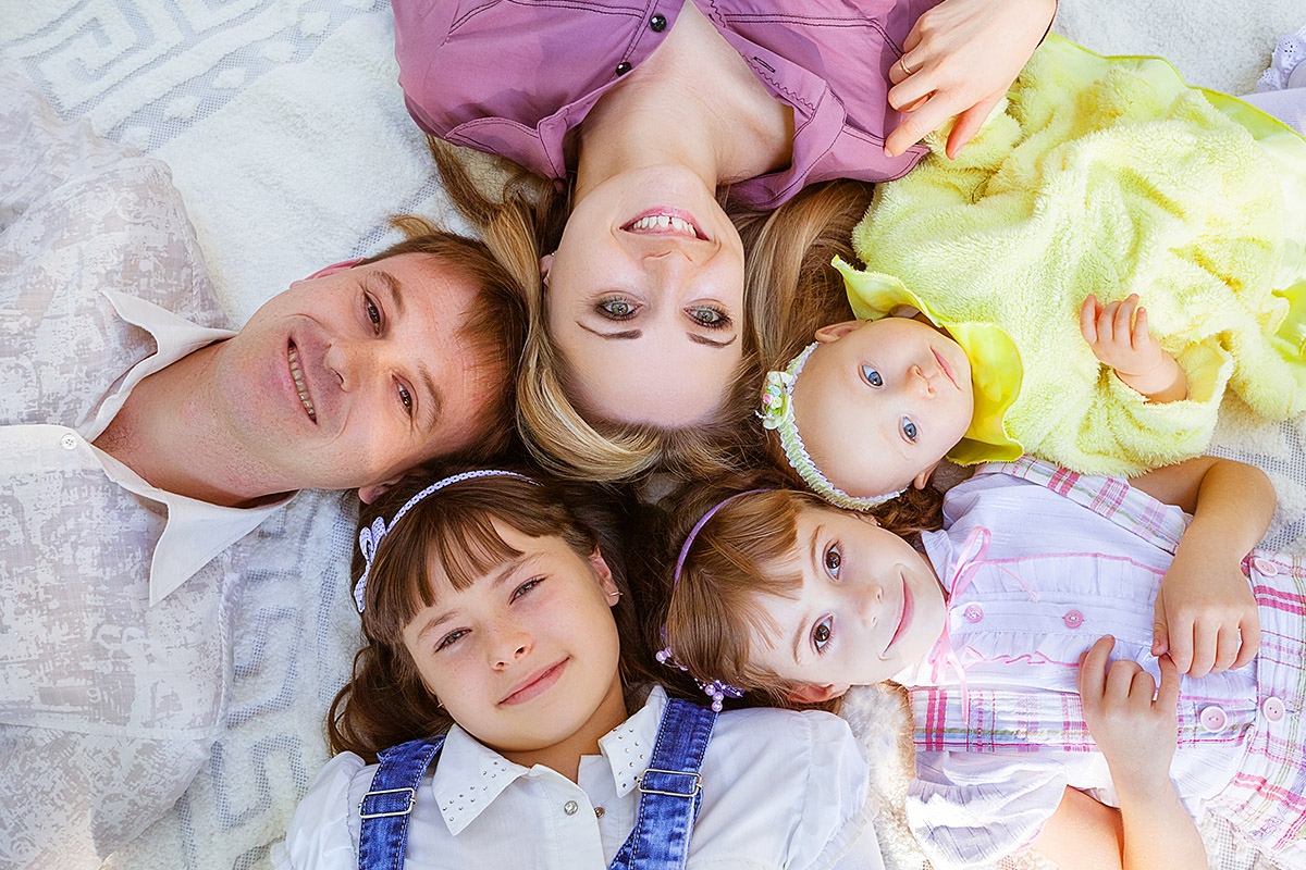 Image of a happy family with three children