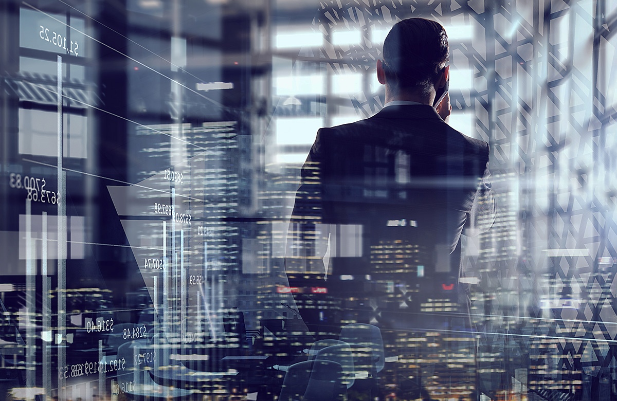 Image of a business man looking at a modern city