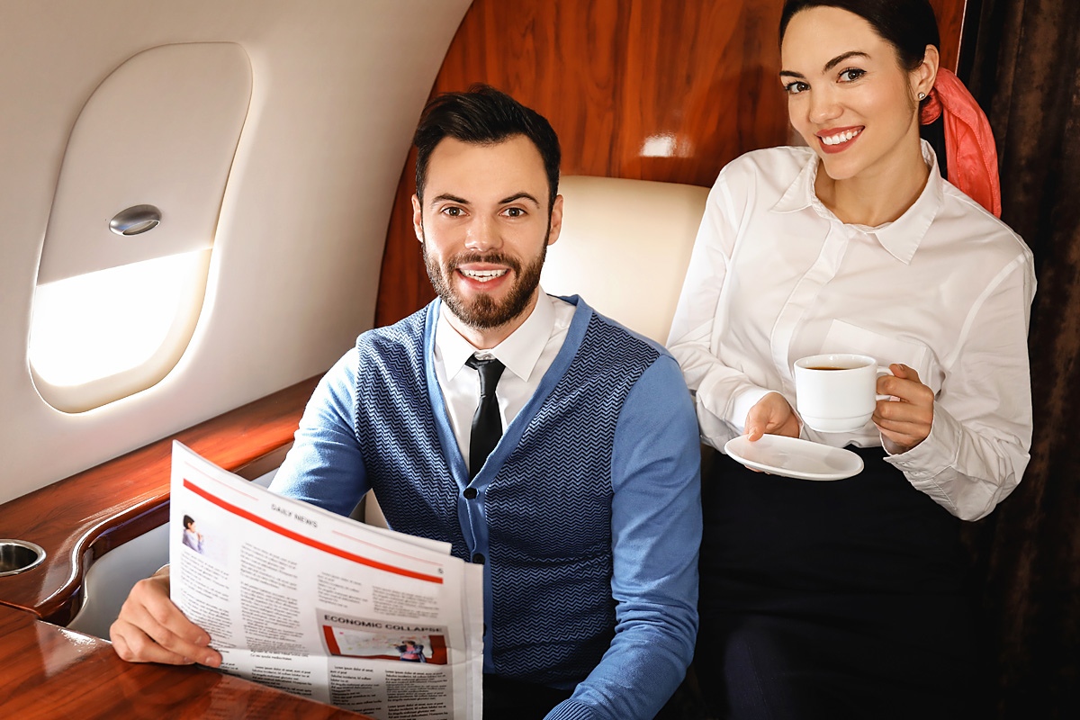 Image of a business couple on board an airplane