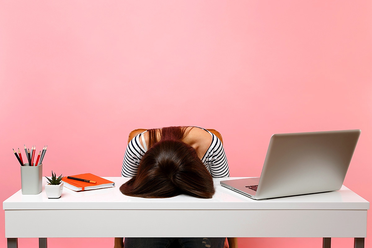 Tired girl at the work desk