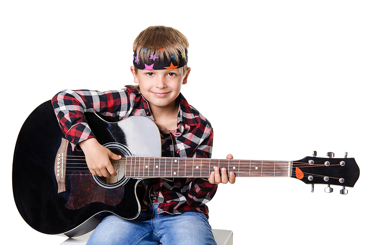 Boy playing the big guitar