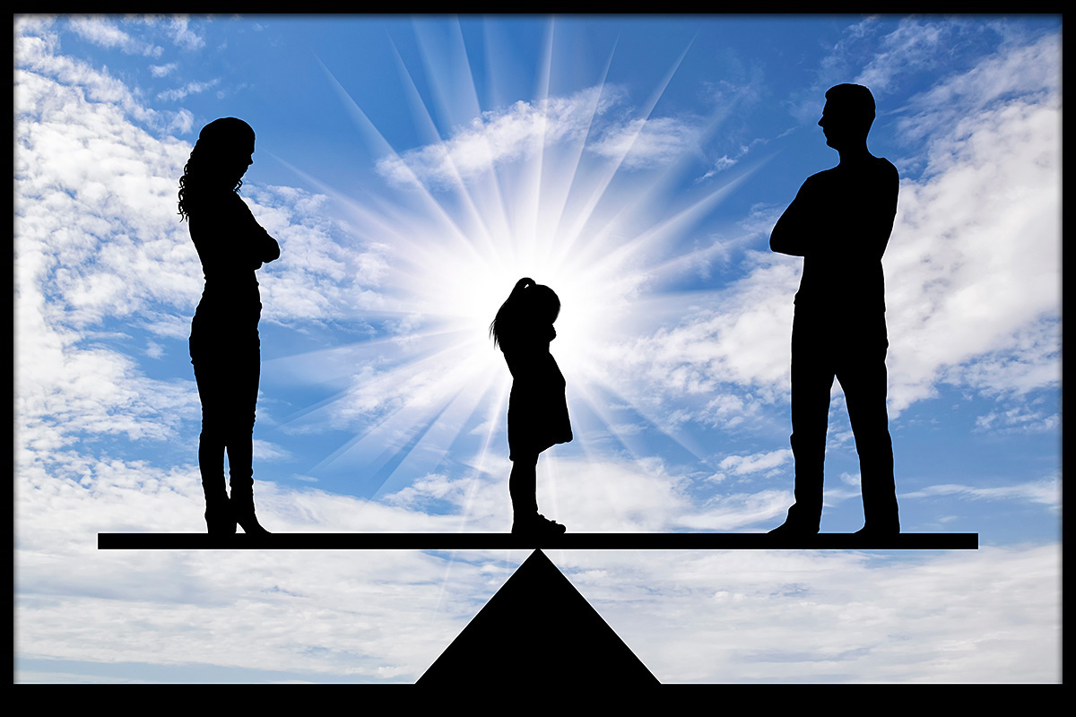 Image of an arguing married couple and a child stands between them Image of an arguing married couple and a child stands between them