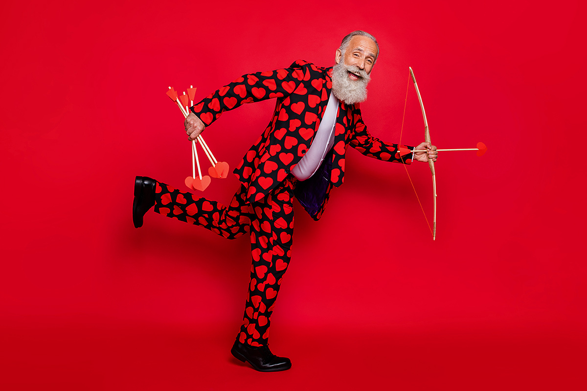 Image of cute grandfather in red suit