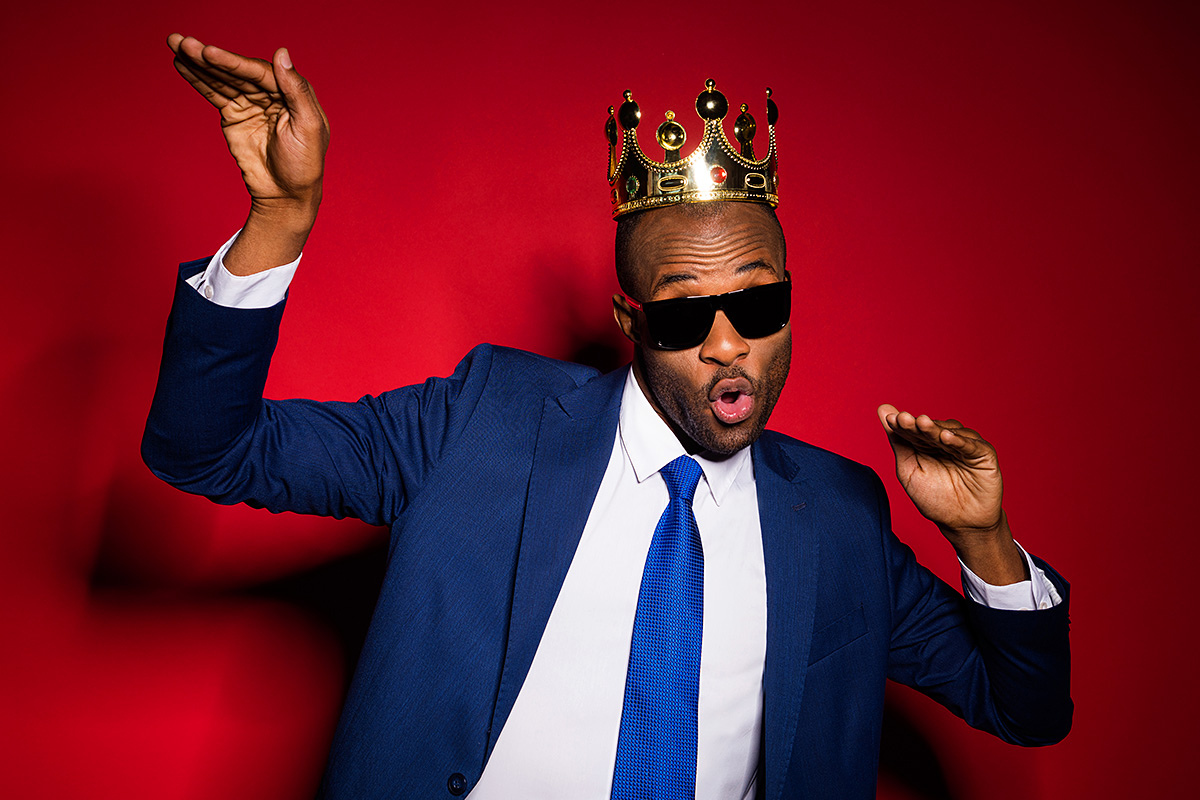 Cheerful man with a crown on his head Cheerful man with a crown on his head