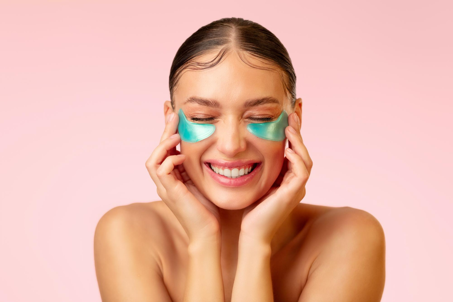 Clean beauty photography showcasing gel eye patches against a soft pink backdrop — simple, radiant, and skincare-focused.