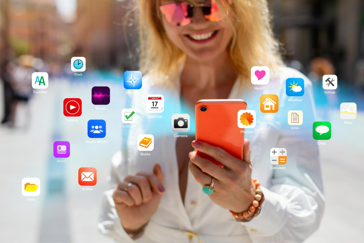 A joyful woman in sunglasses holds a vibrant red-orange smartphone, radiating happiness and digital connectivity.