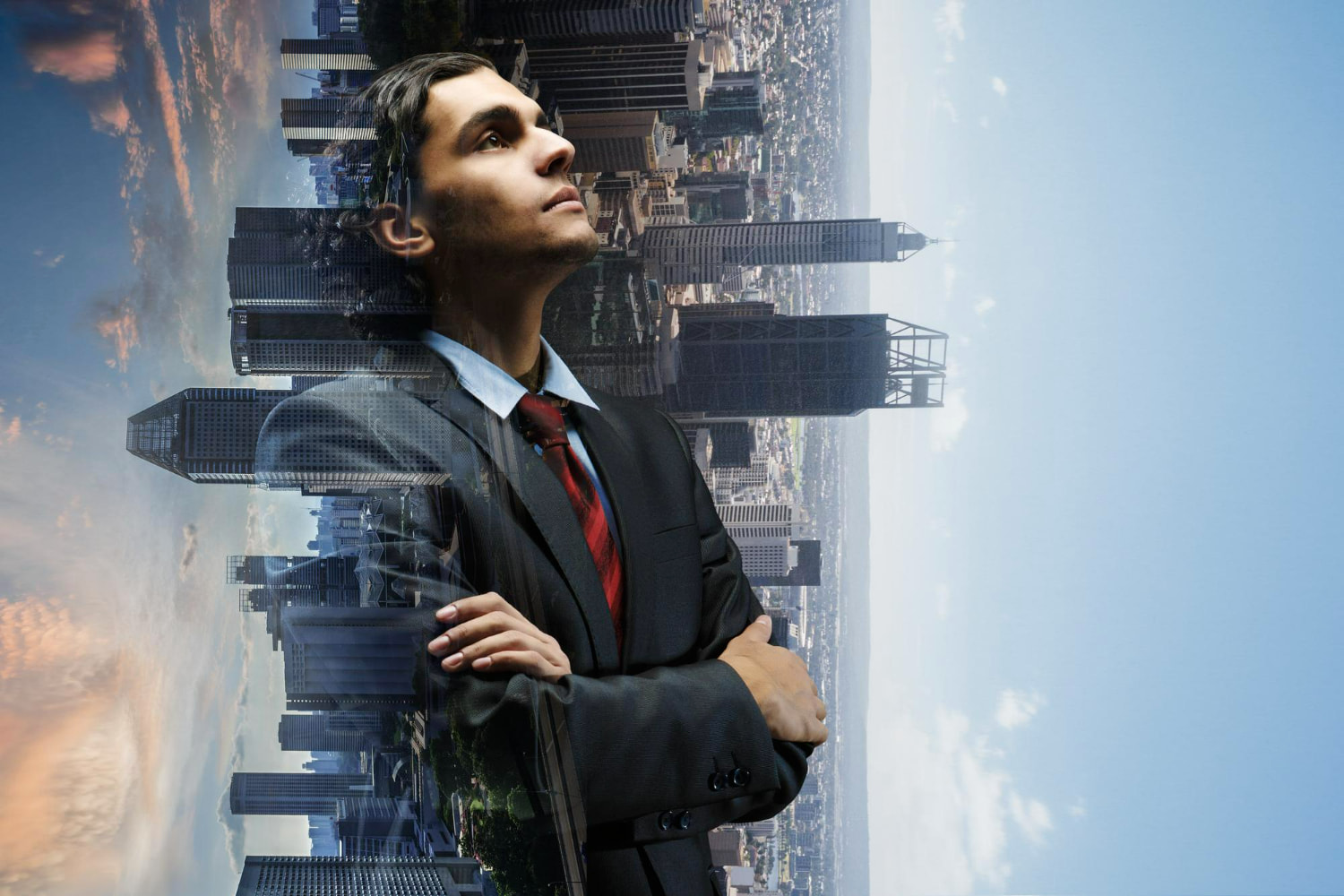 A striking double-exposure composite image merging a professional businessman's profile with a sprawling metropolitan skyline.