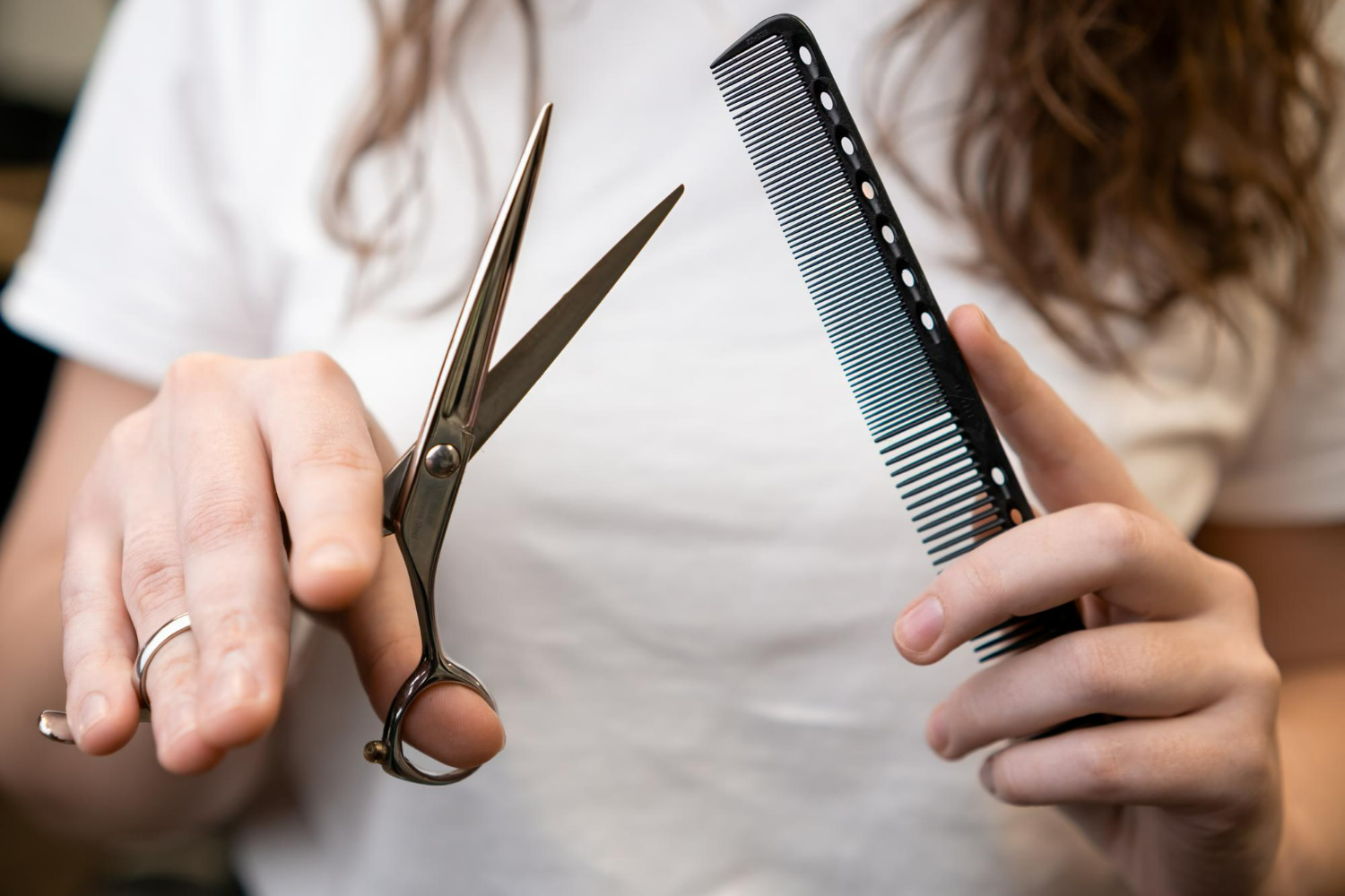 A professional and polished photograph showcasing the essential tools of a hairstylist or barber.