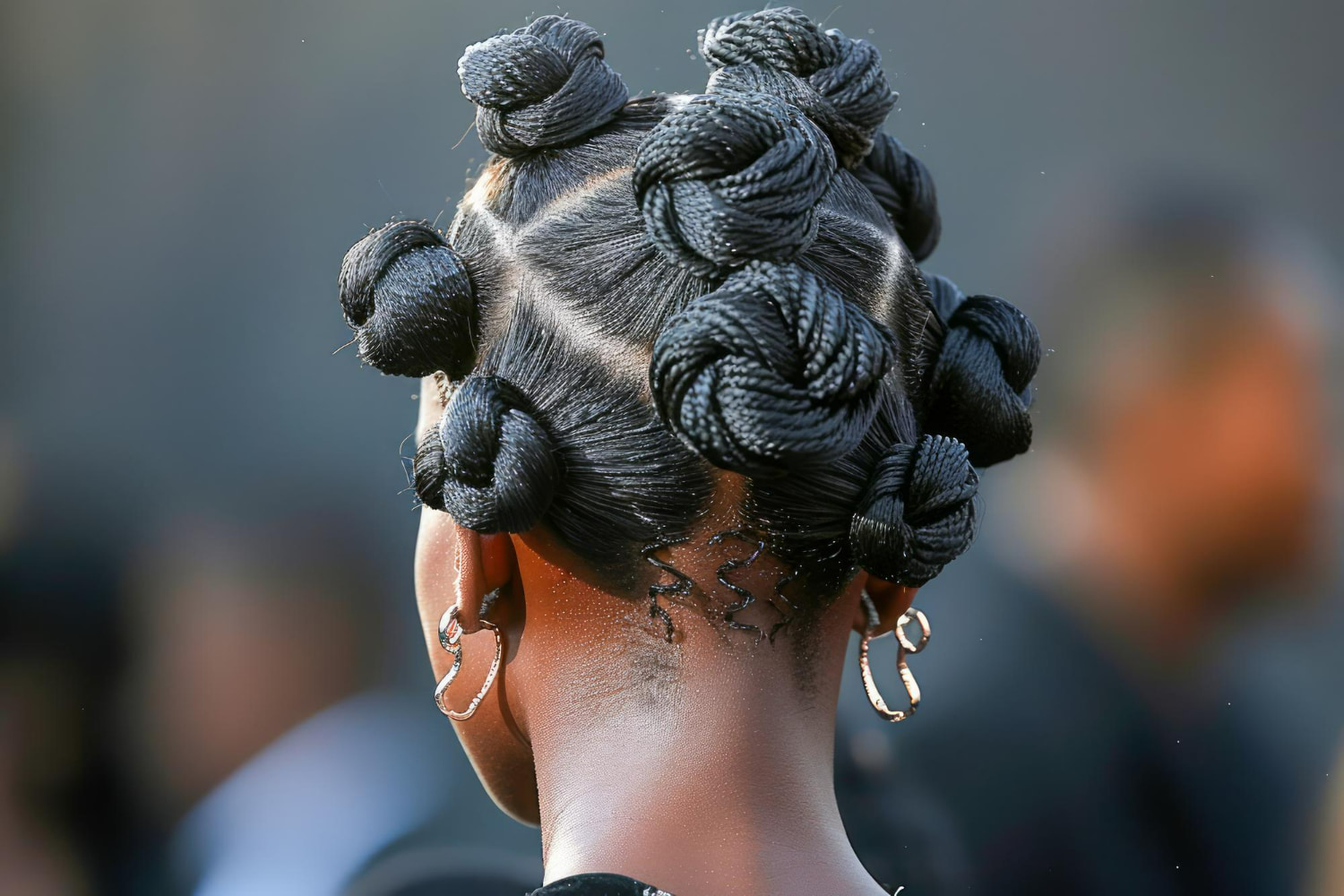 A captivating back-view portrait showcasing an intricately braided hairstyle with multiple twisted coils and knots adorning the crown. A captivating back-view portrait showcasing an intricately braided hairstyle with multiple twisted coils and knots adorning the crown.