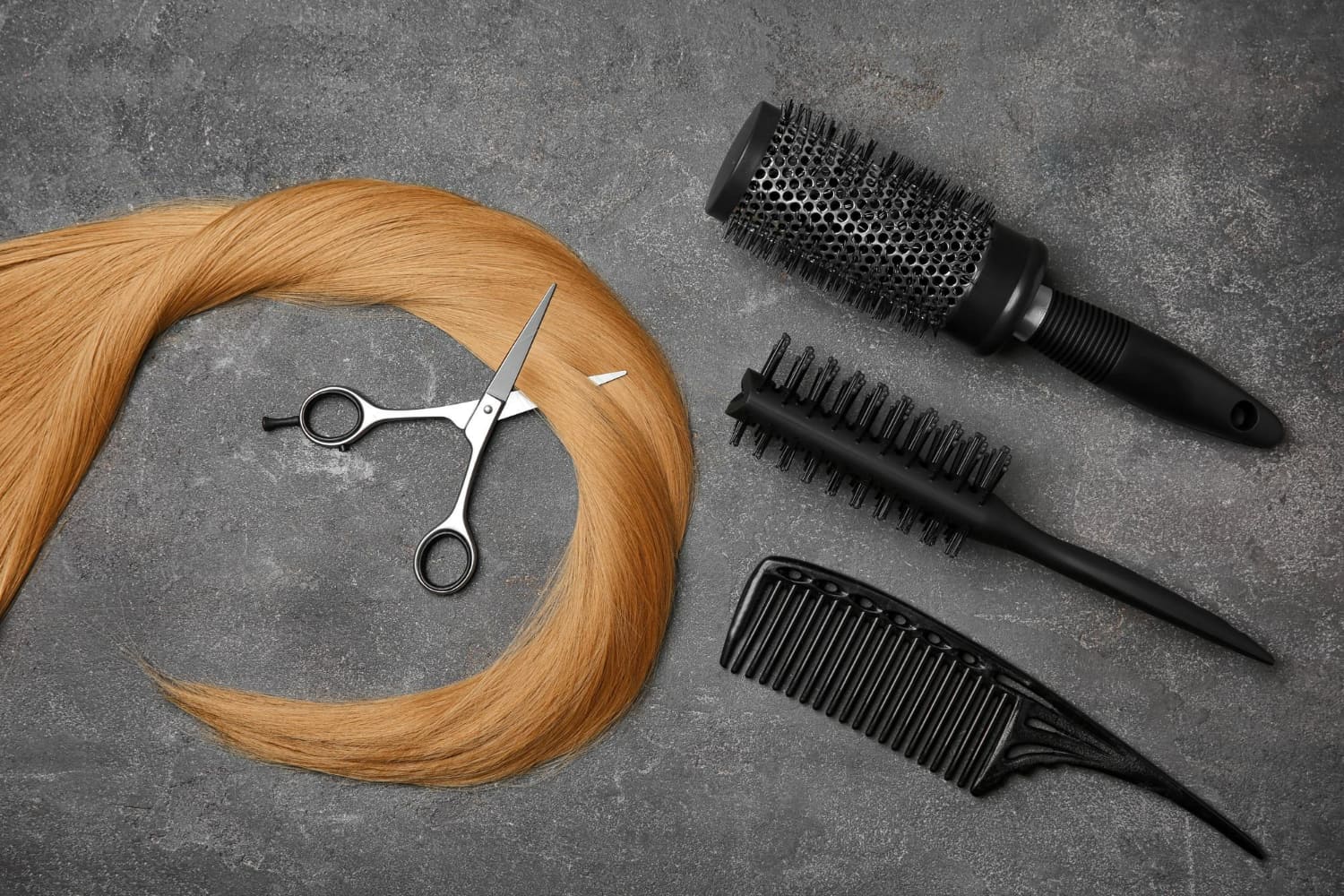 A meticulously arranged overhead flat-lay photograph showcasing a comprehensive collection of professional hair styling tools. A meticulously arranged overhead flat-lay photograph showcasing a comprehensive collection of professional hair styling tools.