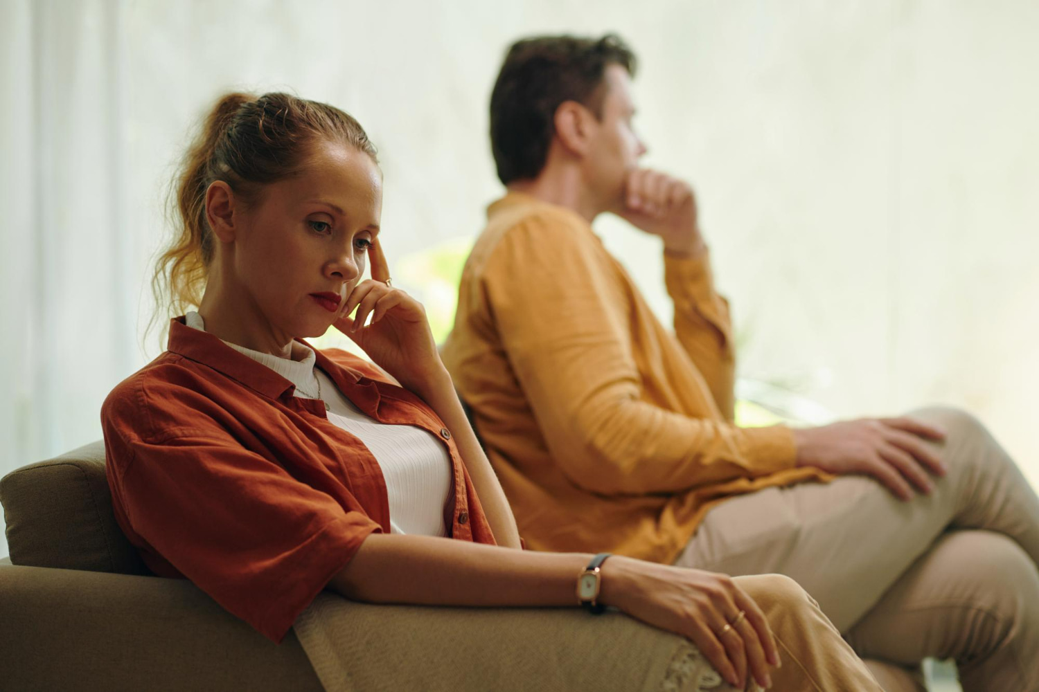 This intimate yet emotionally charged portrait captures a pivotal moment of disconnect and tension between two people in a relationship.